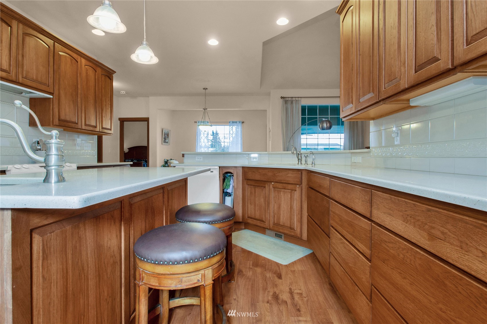 4700 181st Lane Southwest Rochester, WA 98579 - Photo 12 of 30 a large kitchen with stainless steel appliances granite countertop a sink a stove cabinets and a counter top space