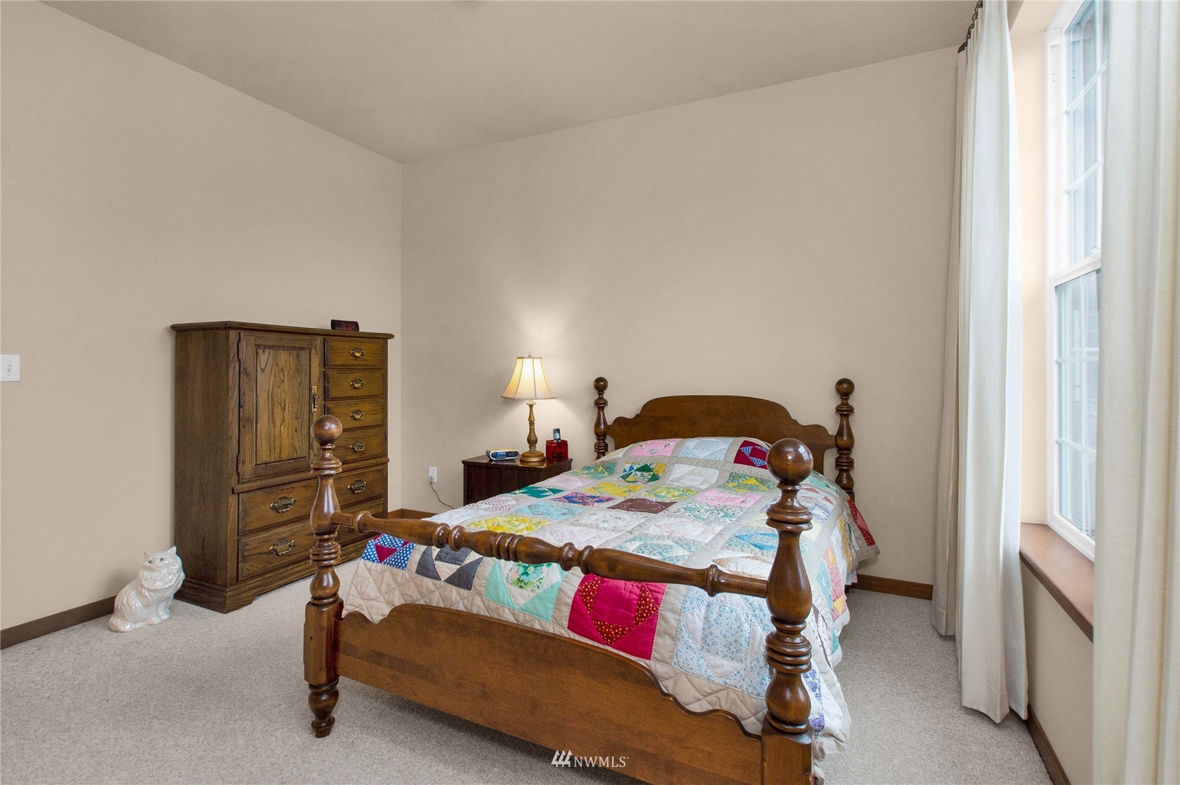 4700 181st Lane Southwest Rochester, WA 98579 - Photo 17 of 30 a bedroom with a bed and a window