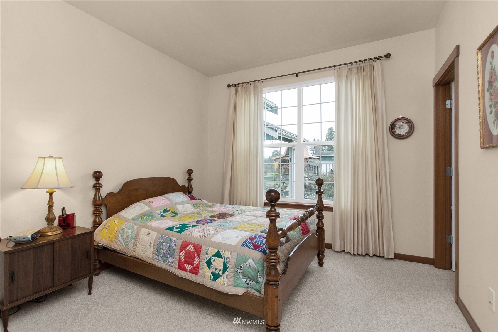 4700 181st Lane Southwest Rochester, WA 98579 - Photo 19 of 30 a bedroom with a bed and a window