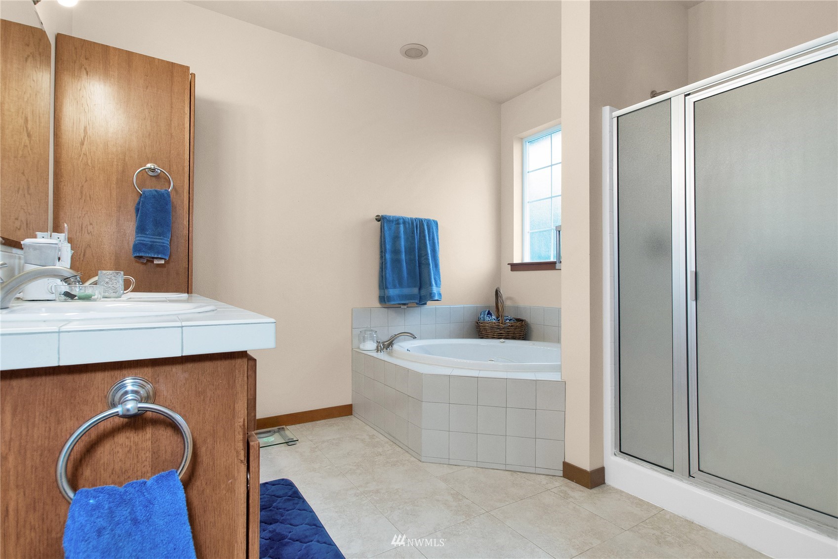 4700 181st Lane Southwest Rochester, WA 98579 - Photo 23 of 30 a en suite bathroom with a granite countertop sink and a mirror