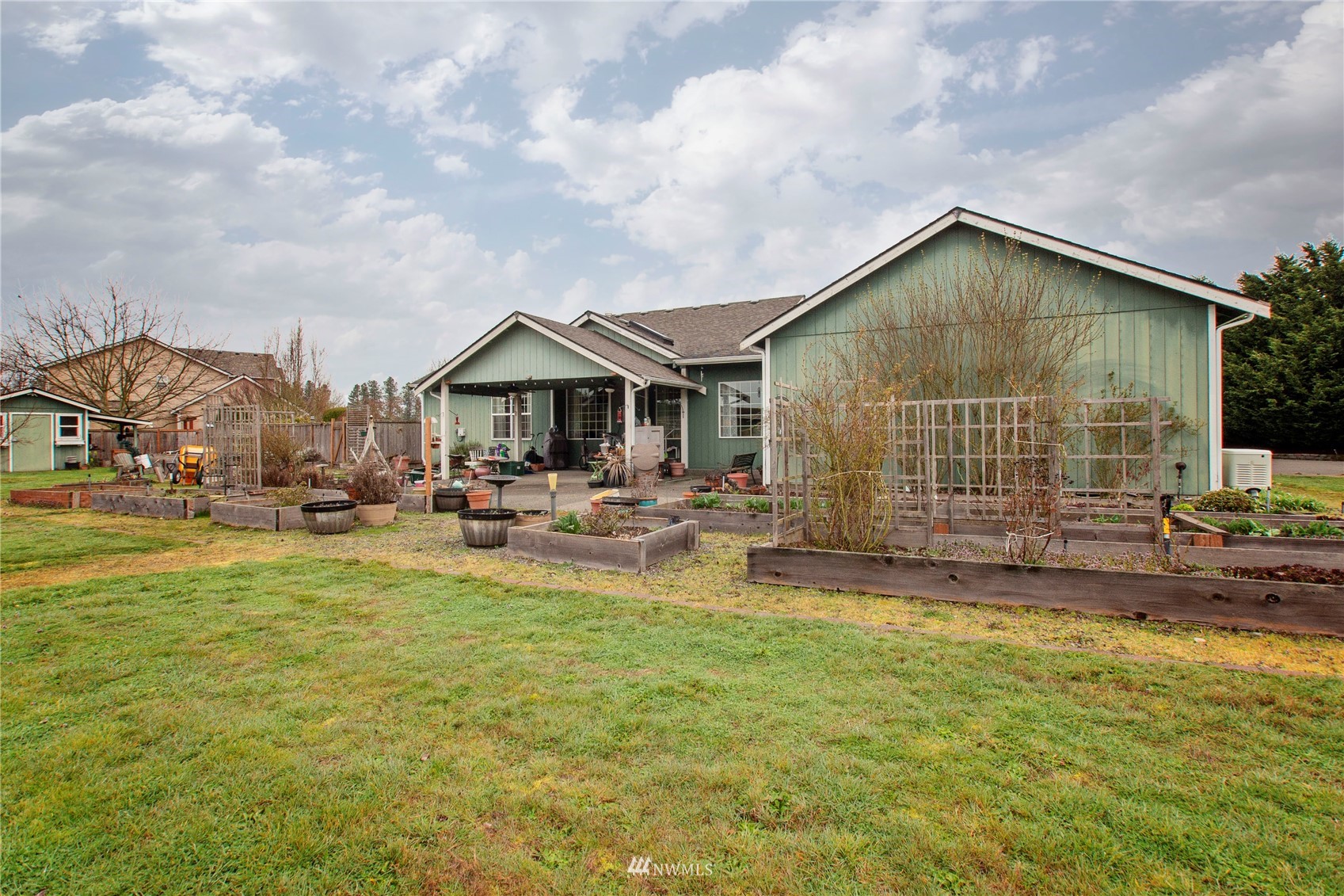 4700 181st Lane Southwest Rochester, WA 98579 - Photo 26 of 30 a view of house with yard and sitting area