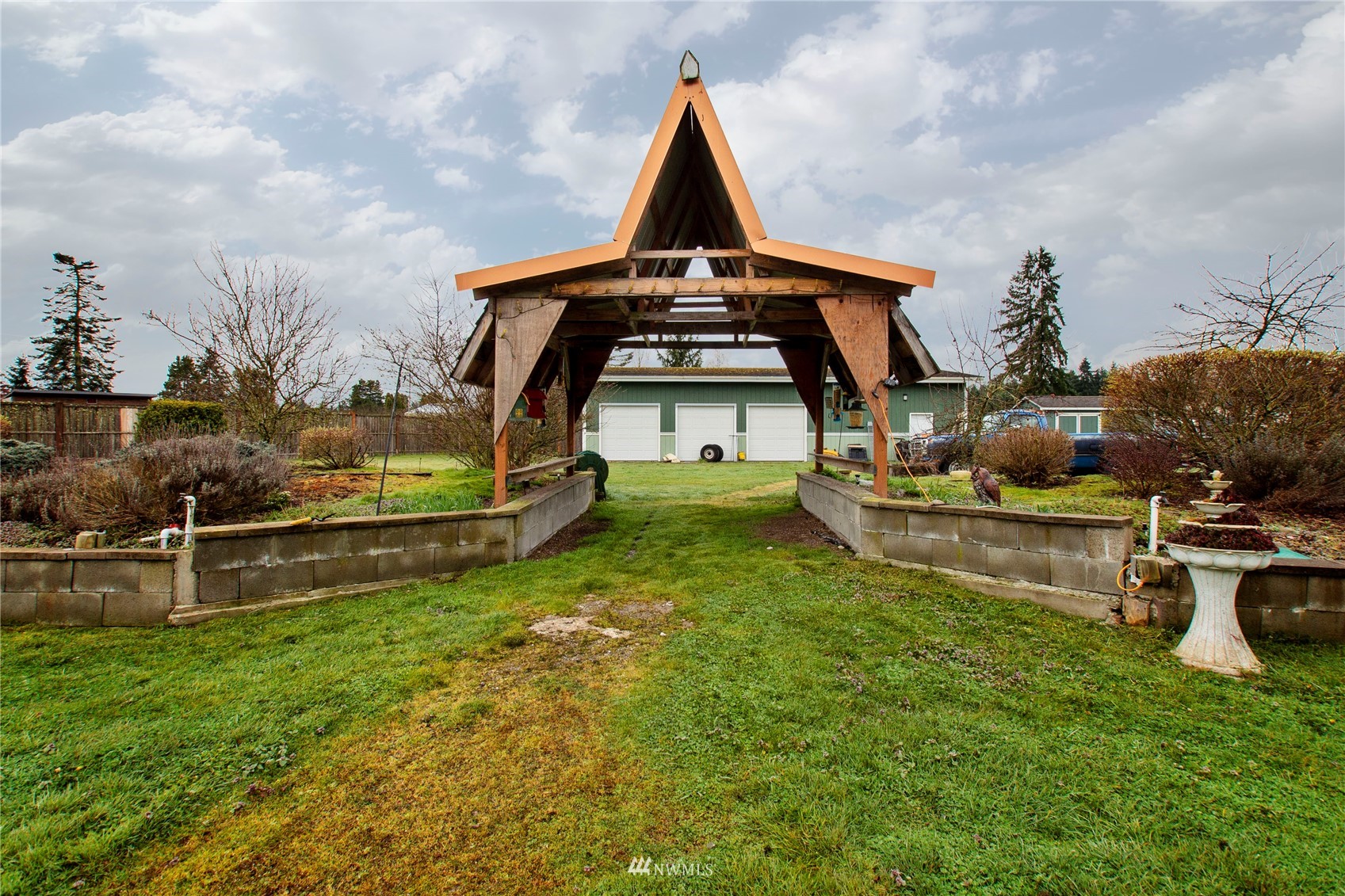 4700 181st Lane Southwest Rochester, WA 98579 - Photo 27 of 30 a front view of a house with garden