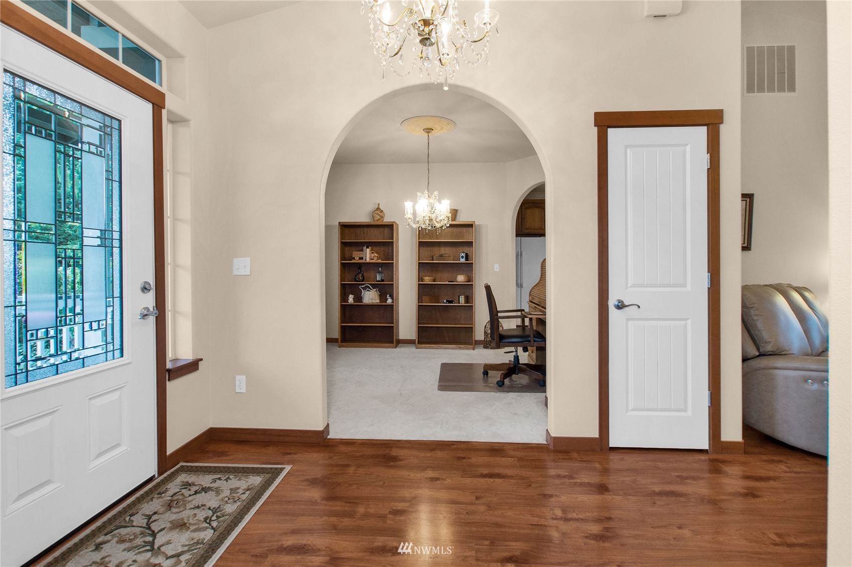 4700 181st Lane Southwest Rochester, WA 98579 - Photo 5 of 30 a view of a hallway with wooden floor and windows