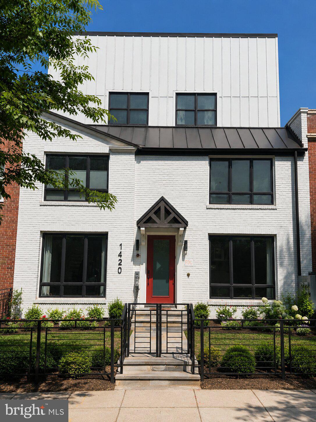 1420 Staples Street Northeast, Unit 1 Washington, DC 20002 - Photo 2 of 22 a front view of a house with garden