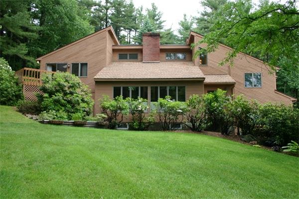 179 Littleton Road Harvard, MA 01451 - Photo 1 of 27 a view of a house with a yard and potted plants