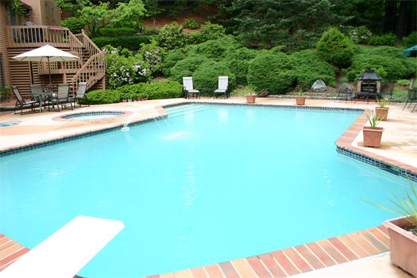 179 Littleton Road Harvard, MA 01451 - Photo 24 of 27 a view of a swimming pool with an outdoor space and seating area