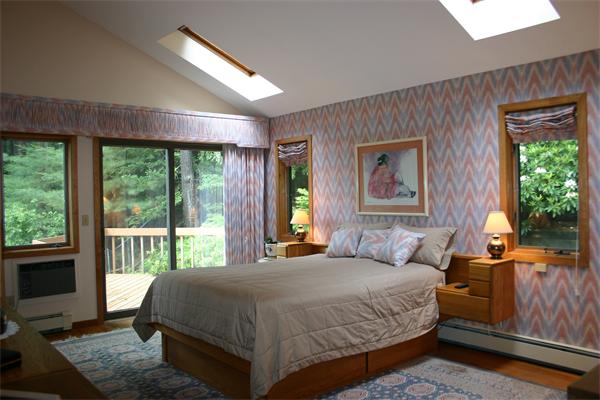 179 Littleton Road Harvard, MA 01451 - Photo 10 of 27 a bedroom with a large bed and a large window