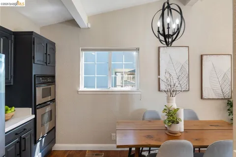 a bedroom with bed and a window