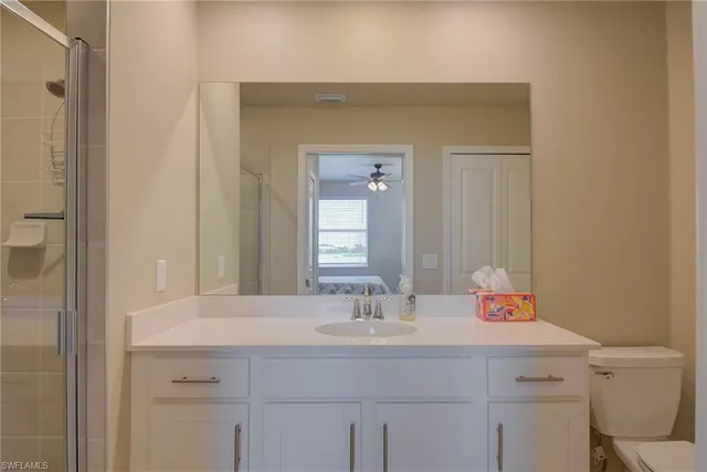 a bathroom with a sink vanity and a mirror