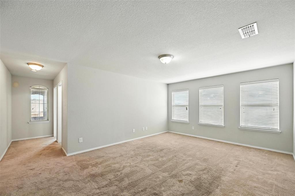 1724 Long Meadow Road Wylie, TX 75098 - Photo 16 of 23 an empty room with windows and closet