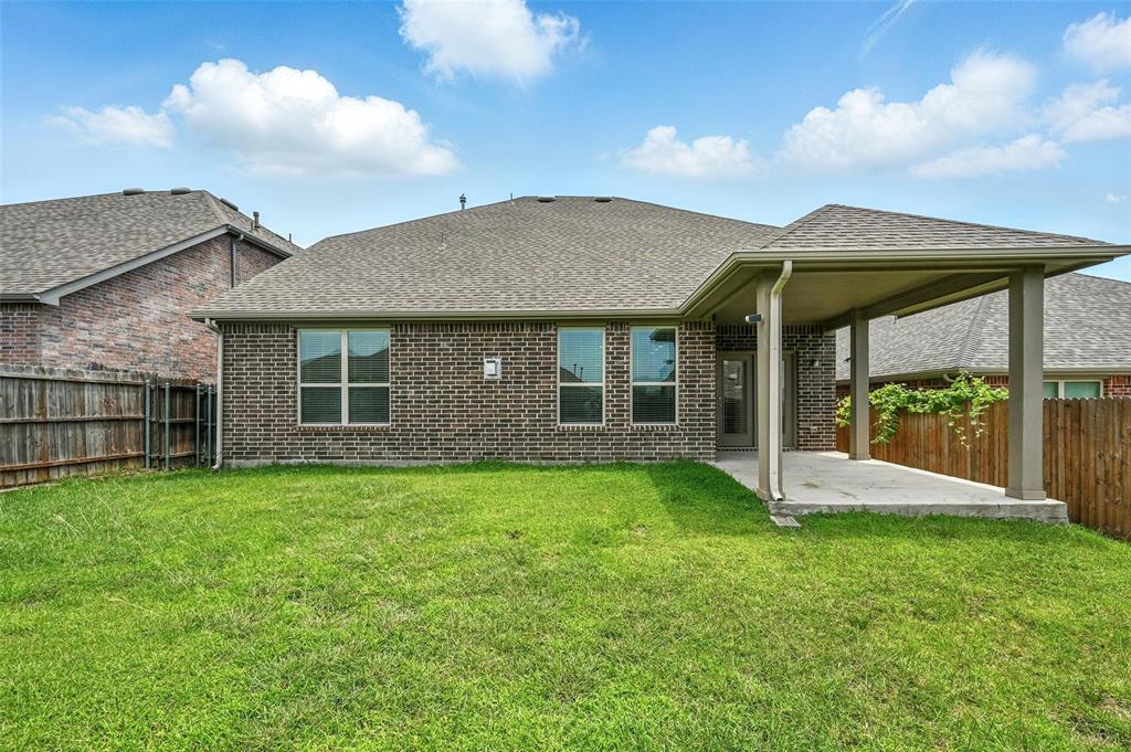 1724 Long Meadow Road Wylie, TX 75098 - Photo 20 of 23 a view of a house with a yard and porch