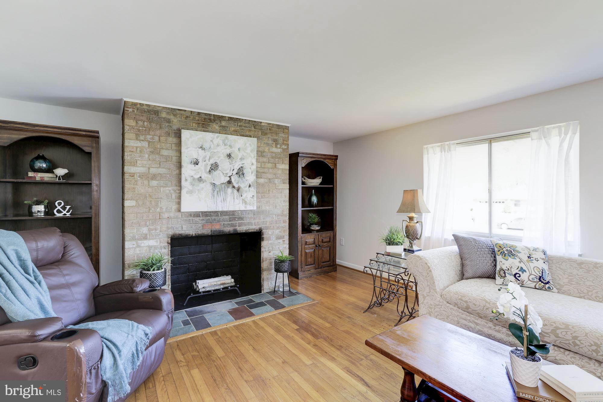 3113 Winifred Drive Burtonsville, MD 20866 - Photo 8 of 31 Brick wood-burning fireplace in living room