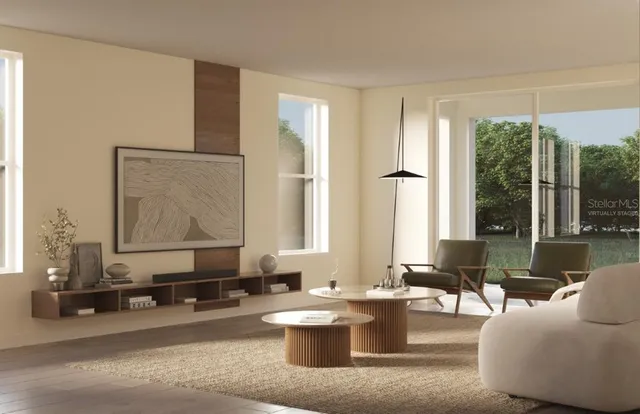 a living room with furniture and large window
