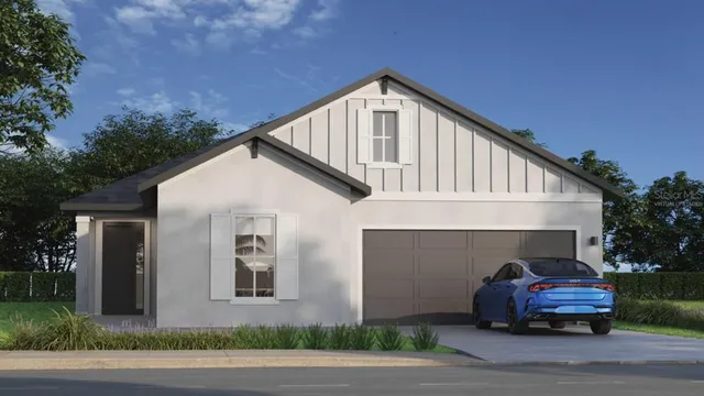 a front view of a house with parking area and garage