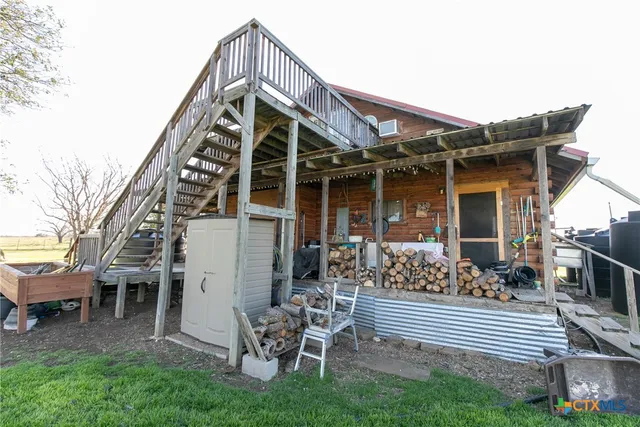 a view of a table and chairs in the garden