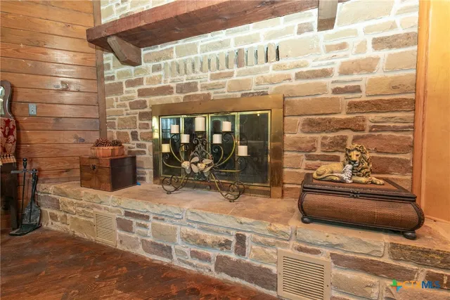 a kitchen with white cabinets and sink