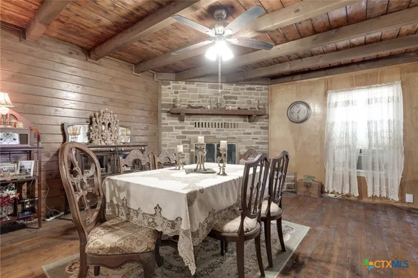 a kitchen with refrigerator a microwave a sink and cabinets