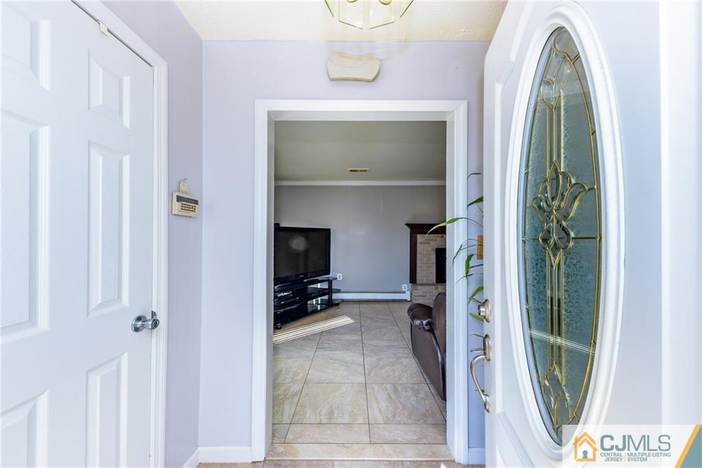 61 Gurley Road Edison, NJ 08817 - Photo 2 of 21 a view of walk in closet with clothes and shoes