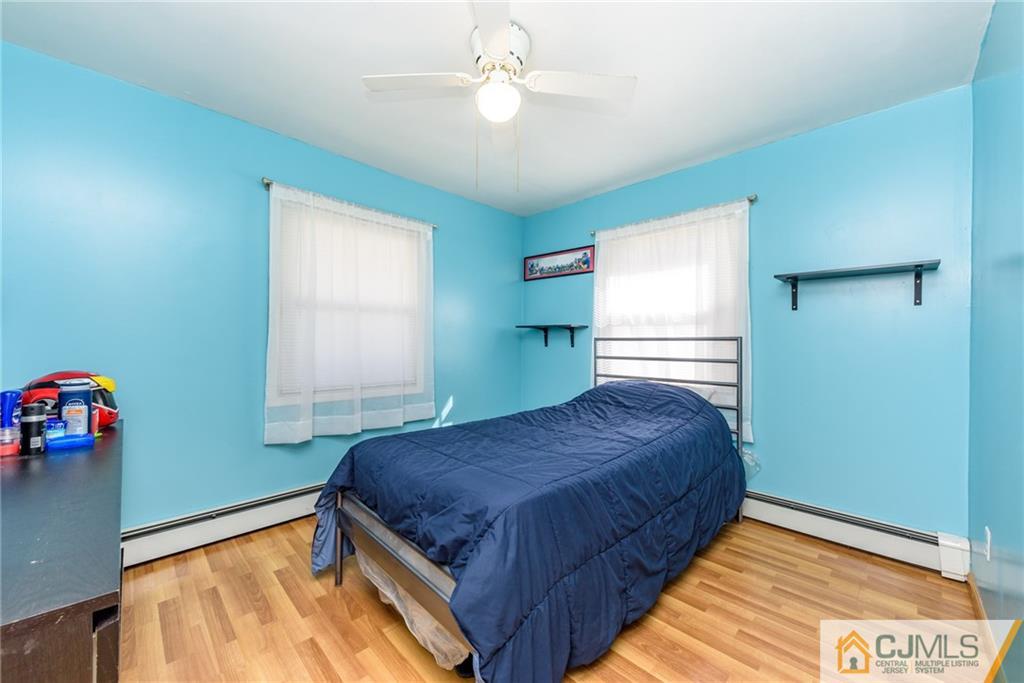 61 Gurley Road Edison, NJ 08817 - Photo 12 of 21 a bedroom with a bed and a window
