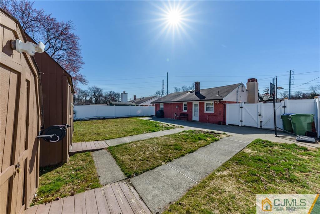 61 Gurley Road Edison, NJ 08817 - Photo 19 of 21 a view of a house with backyard