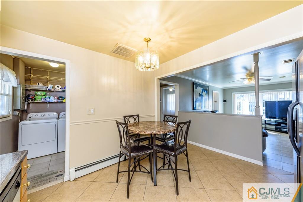61 Gurley Road Edison, NJ 08817 - Photo 9 of 21 a view of a dining room with furniture and wooden floor