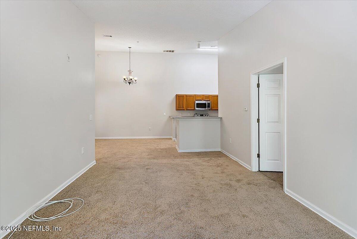 7920 Merrill Road, Unit 1014 Jacksonville, FL 32277 - Photo 3 of 12 03-Living Room & Dining Room