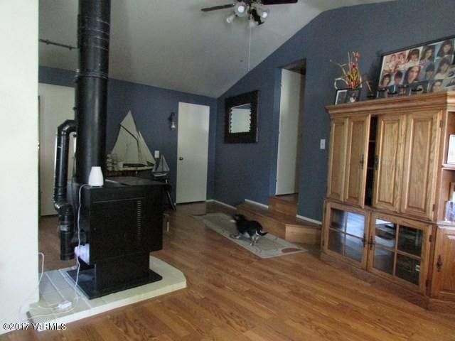 96802 West Good Road Prosser, WA 99350 - Photo 3 of 15 a room with wooden floor and furniture