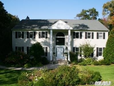 50 Cedarfield Road Laurel Hollow, NY 11791 - Photo 1 of 1 a front view of a house with a yard