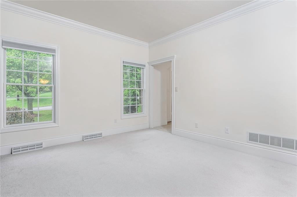 186 Warren Road Warrendale, PA 15086 - Photo 3 of 24 A view of the living room located in the front of the home off of the entry. Note the beautiful high baseboards as well as the gorgeous crown molding. There are pleated custom levolor blinds in the windows that will allow privacy when desired.