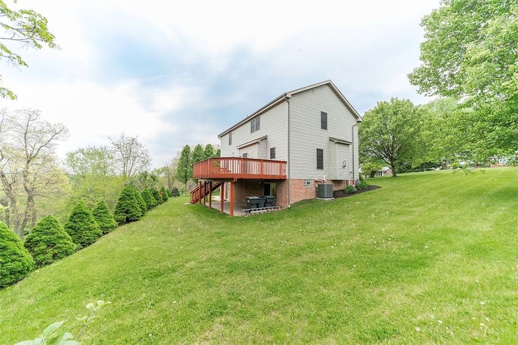 186 Warren Road Warrendale, PA 15086 - Photo 23 of 24 A view of one side of the house that showcases additional yard space and tranquil views!