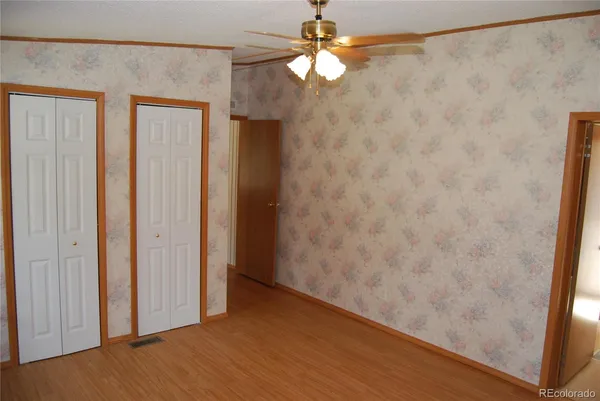 a bathroom with a shower and toilet