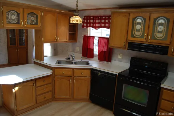 a kitchen with stainless steel appliances granite countertop a stove and a sink
