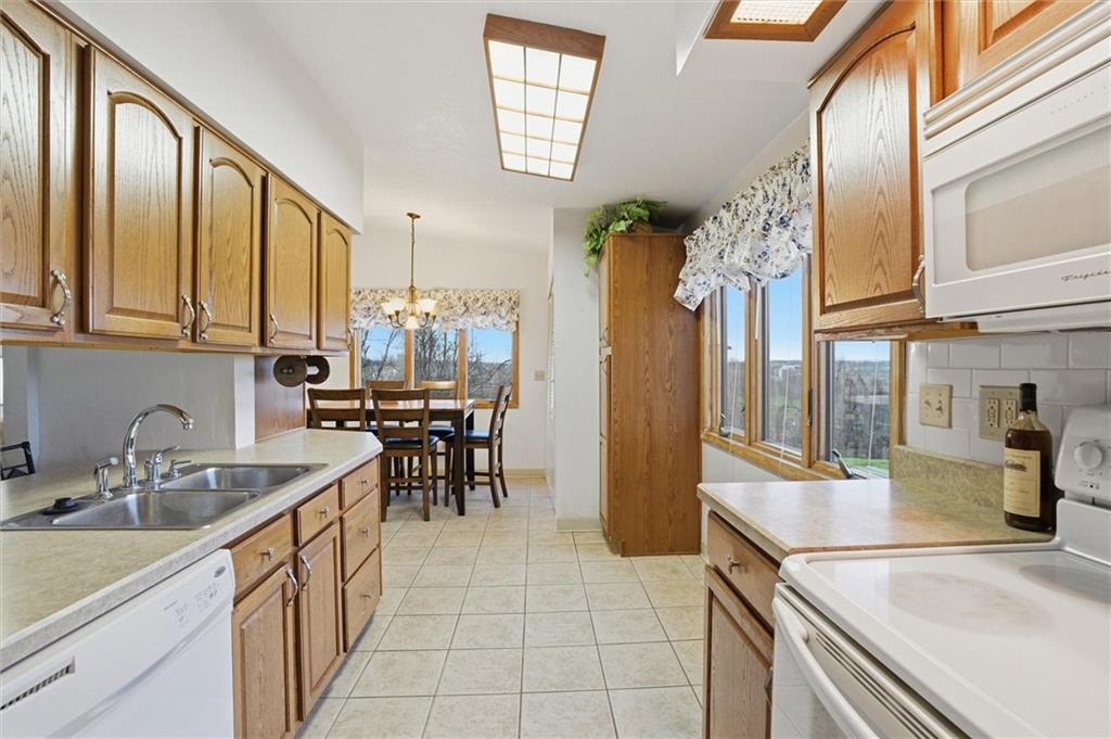 537 Lebanon School Road Belle Vernon, PA 15012 - Photo 12 of 48 a kitchen with stainless steel appliances granite countertop a sink and cabinets