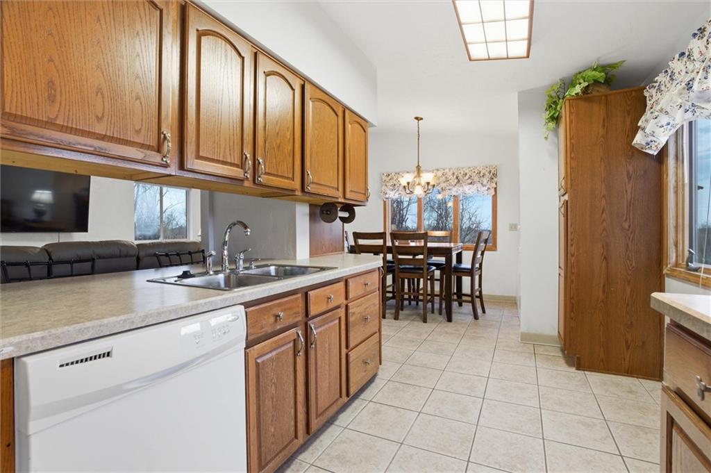 537 Lebanon School Road Belle Vernon, PA 15012 - Photo 13 of 48 a kitchen with stainless steel appliances granite countertop a refrigerator and a stove top oven