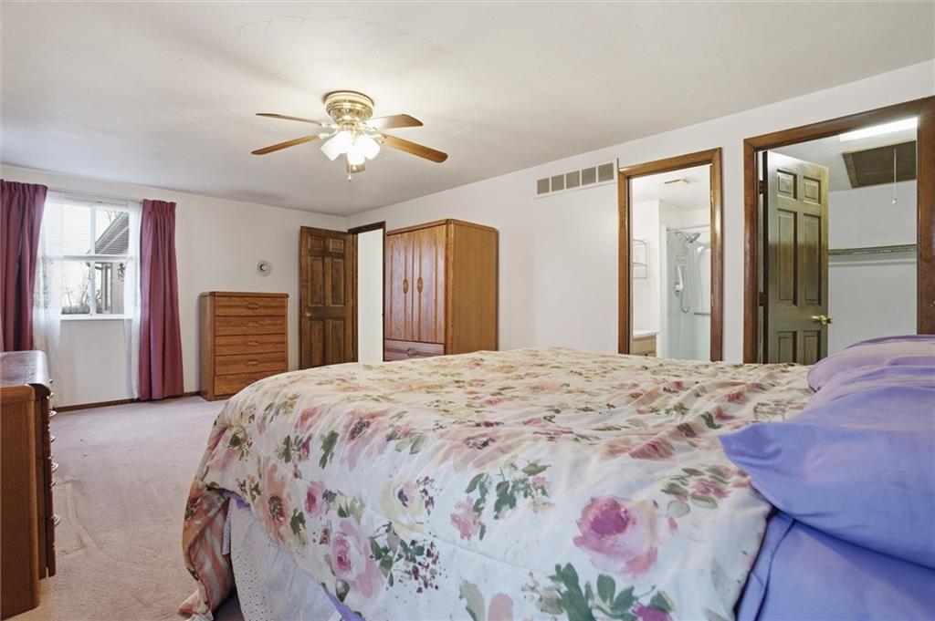 537 Lebanon School Road Belle Vernon, PA 15012 - Photo 18 of 48 a bedroom with a large bed and a window