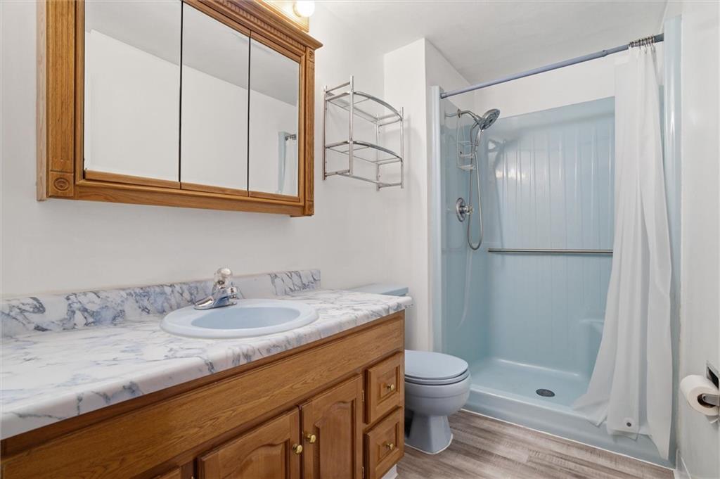 537 Lebanon School Road Belle Vernon, PA 15012 - Photo 19 of 48 a bathroom with a granite countertop sink toilet and shower