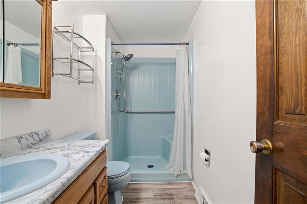 537 Lebanon School Road Belle Vernon, PA 15012 - Photo 20 of 48 a bathroom with a granite countertop sink toilet and shower glass cabinet