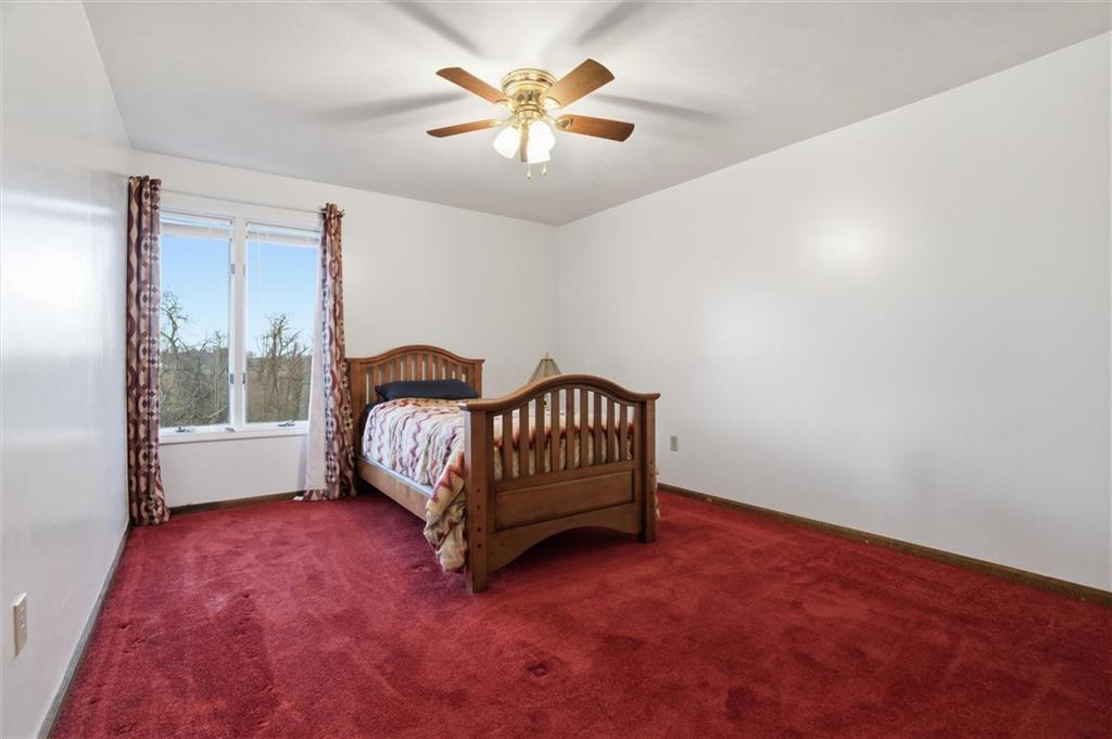 537 Lebanon School Road Belle Vernon, PA 15012 - Photo 22 of 48 a bedroom with a bed and a window