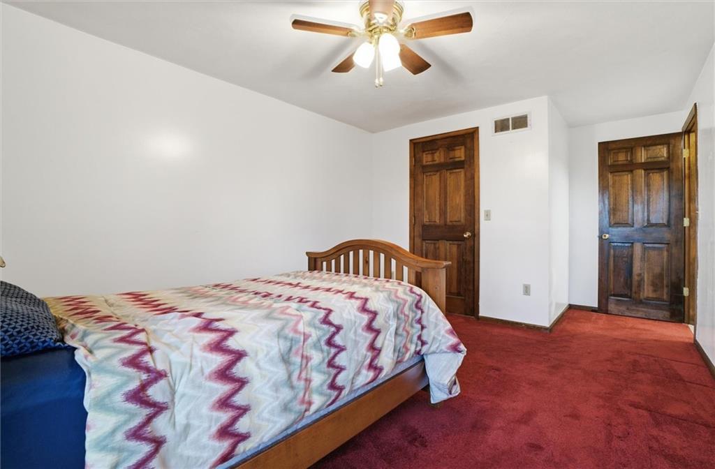 537 Lebanon School Road Belle Vernon, PA 15012 - Photo 23 of 48 a bedroom with a bed and a chandelier