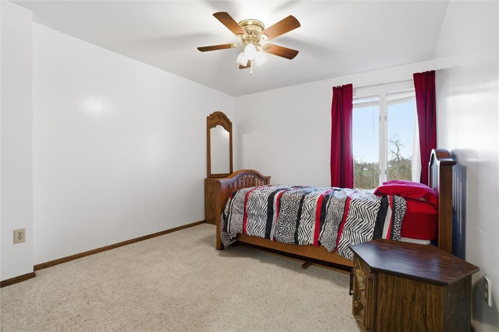 537 Lebanon School Road Belle Vernon, PA 15012 - Photo 24 of 48 a bedroom with a bed and a chandelier