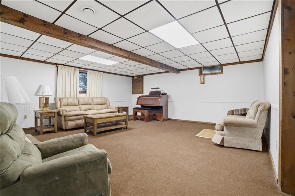 537 Lebanon School Road Belle Vernon, PA 15012 - Photo 28 of 48 a living room with furniture and a chandelier