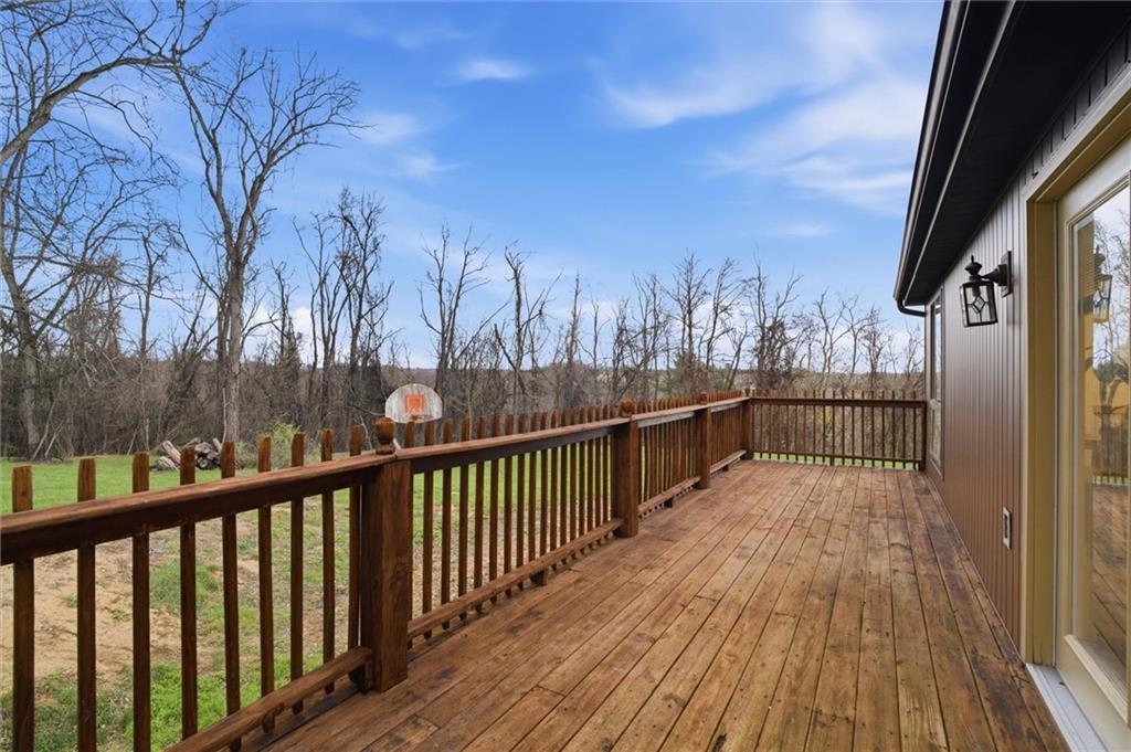 537 Lebanon School Road Belle Vernon, PA 15012 - Photo 37 of 48 a view of a balcony with wooden floor and fence
