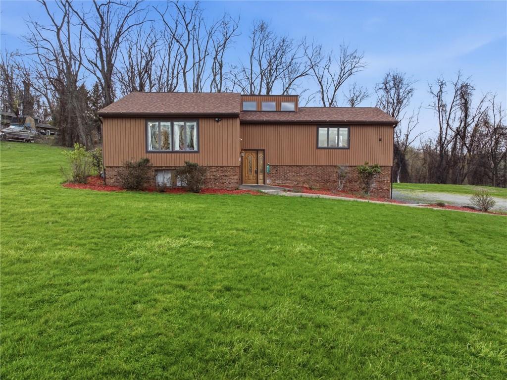 537 Lebanon School Road Belle Vernon, PA 15012 - Photo 43 of 48 a front view of a house with a garden