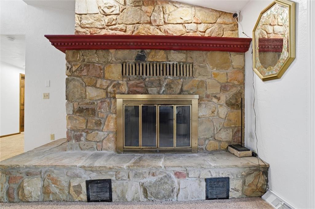 537 Lebanon School Road Belle Vernon, PA 15012 - Photo 5 of 48 a view of a fireplace with a door and wooden floor