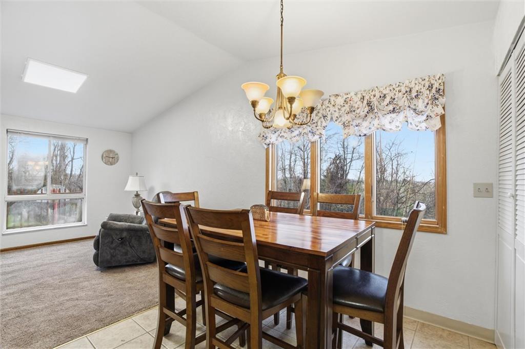 537 Lebanon School Road Belle Vernon, PA 15012 - Photo 8 of 48 a view of a dining room with furniture wooden floor and chandelier