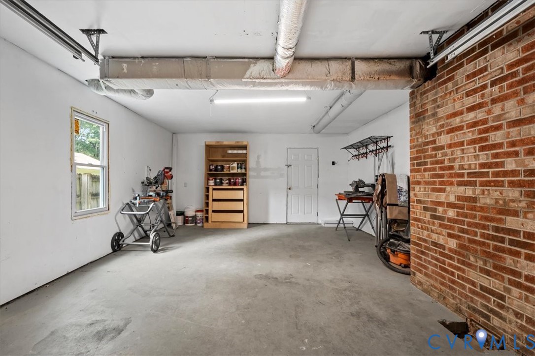 7010 Slate Road Chesterfield, VA 23832 - Photo 18 of 45 Spacious garage with concrete flooring, a single w