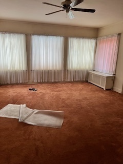 7611 South Ridgeland Avenue Chicago, IL 60649 - Photo 2 of 7 an empty room with windows and fan