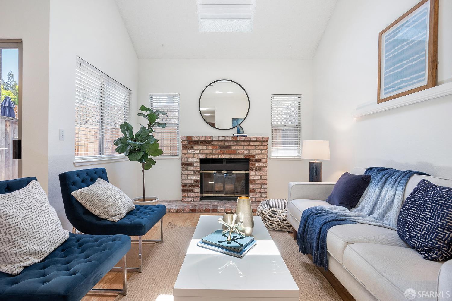 3937 Vine Street Pleasanton, CA 94566 - Photo 13 of 30 a living room with furniture a fireplace and a large mirror