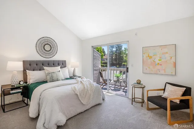 a bedroom with bed and a window