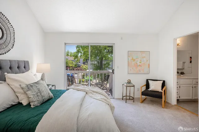 a bedroom with a bed and a couch